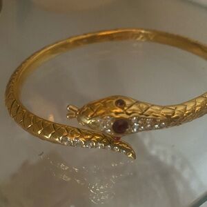 Luxurious Gold Snake Bangle with Red Accents